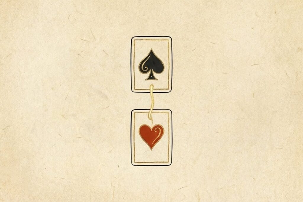 黒（スペード）と赤（ハート）のカードがつながるイラスト（ソリティアで色を交互に重ねて移動する基本ルール）